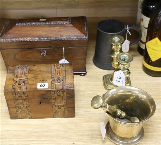 An 18th century bell metal pestle and mortar, a pair of brass candlesticks, two tea caddies and a pewter quart mug